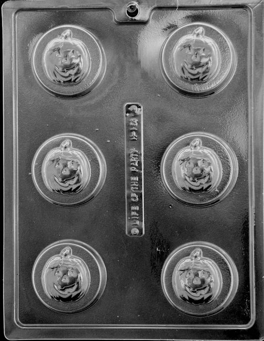 Clear plastic mold tray with six round cavities, each featuring a smiling jack-o’-lantern face sized for chocolate-covered sandwich cookies.