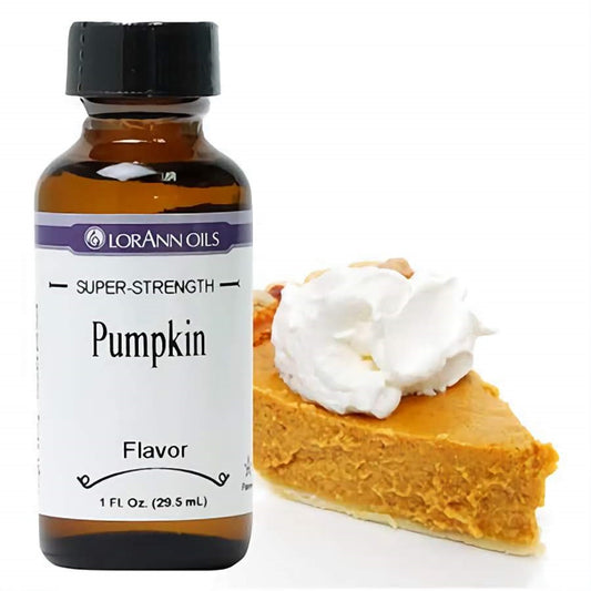 Small bottle of LorAnn Oils Super-Strength Pumpkin Flavor, complemented by a slice of pumpkin pie topped with whipped cream, capturing the essence of fall and festive baking.