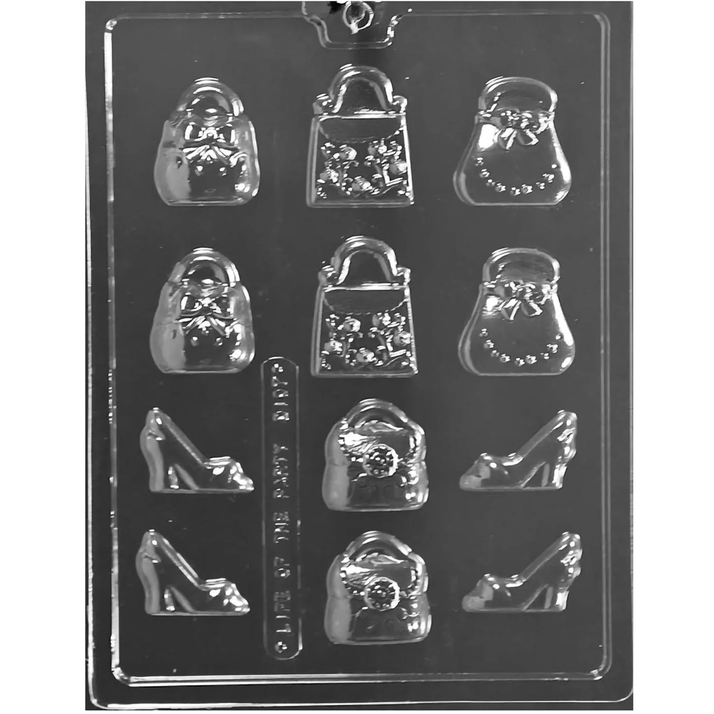 Clear plastic chocolate mold with small purse and high heel shoe cavities in assorted handbag styles, shown on a dark background.