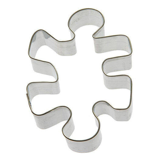 Puzzle piece-shaped cookie cutter in silver tin, measuring 3.5 inches, ideal for themed cookies and crafts.