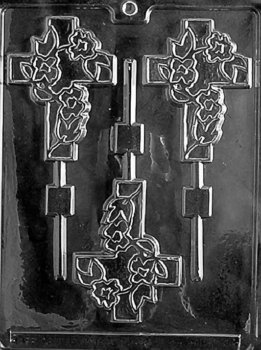 R028 FANCY CROSS Lollipop chocolate mold with ornate cross-shaped lollipop cavities featuring scroll details.
