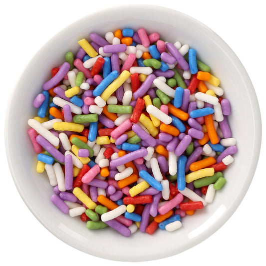White bowl filled with Rainbow Natural Dyed Made Simply™ Sprinkles in pink, purple, blue, green, yellow, orange, red, and white.