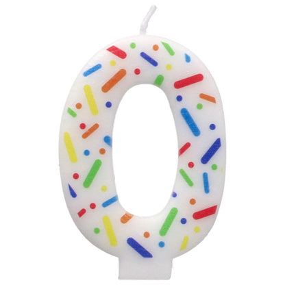 Candle shaped like the number 0 with colorful sprinkles on a white background
