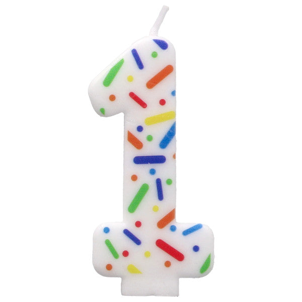 White birthday candle shaped like the number '1' with colorful sprinkles on a white background