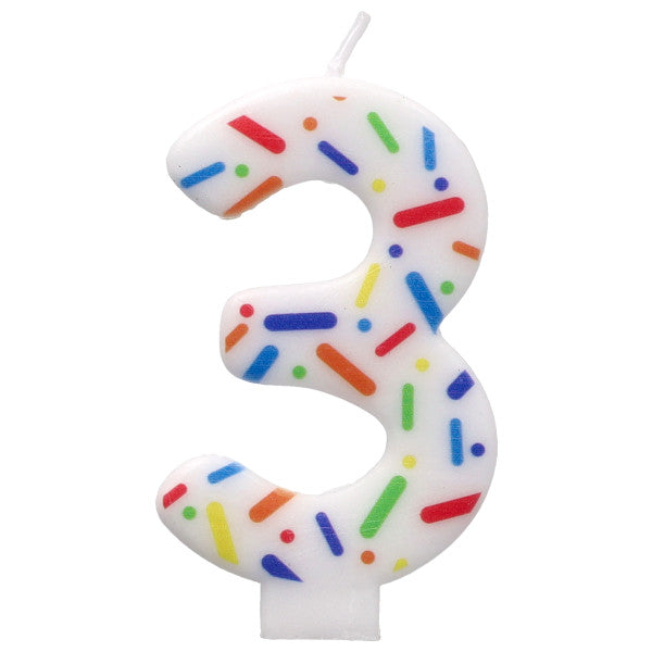 Number 3 birthday candle with colorful sprinkles on a white background