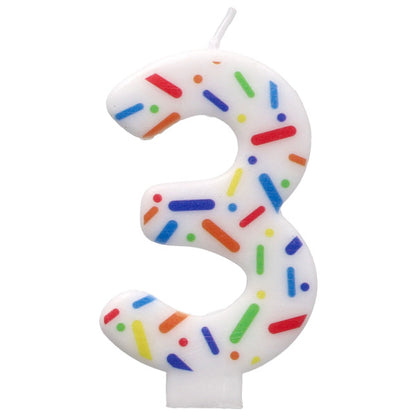 Number 3 birthday candle with colorful sprinkles on a white background