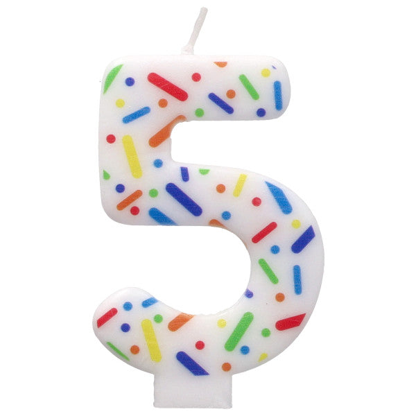White candle shaped like the number '5' with colorful sprinkles on a white background