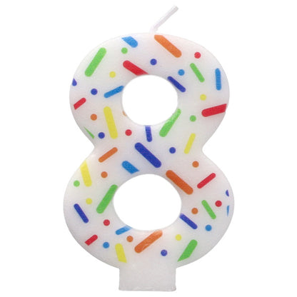 Candle shaped like the number 8 with colorful sprinkles on a white background