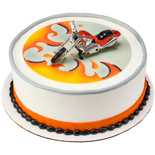 Round cake with orange flames and red chopper motorcycle topper.