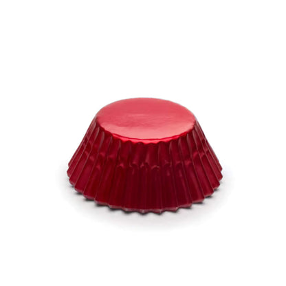 Metallic mini foil baking cup in red with fluted sides, shown upside down on a white background.