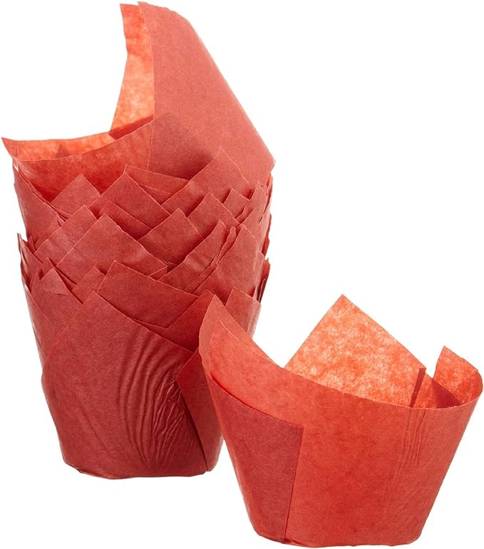 Stack of red tulip-style baking cup liners with one liner separated and placed beside the stack.