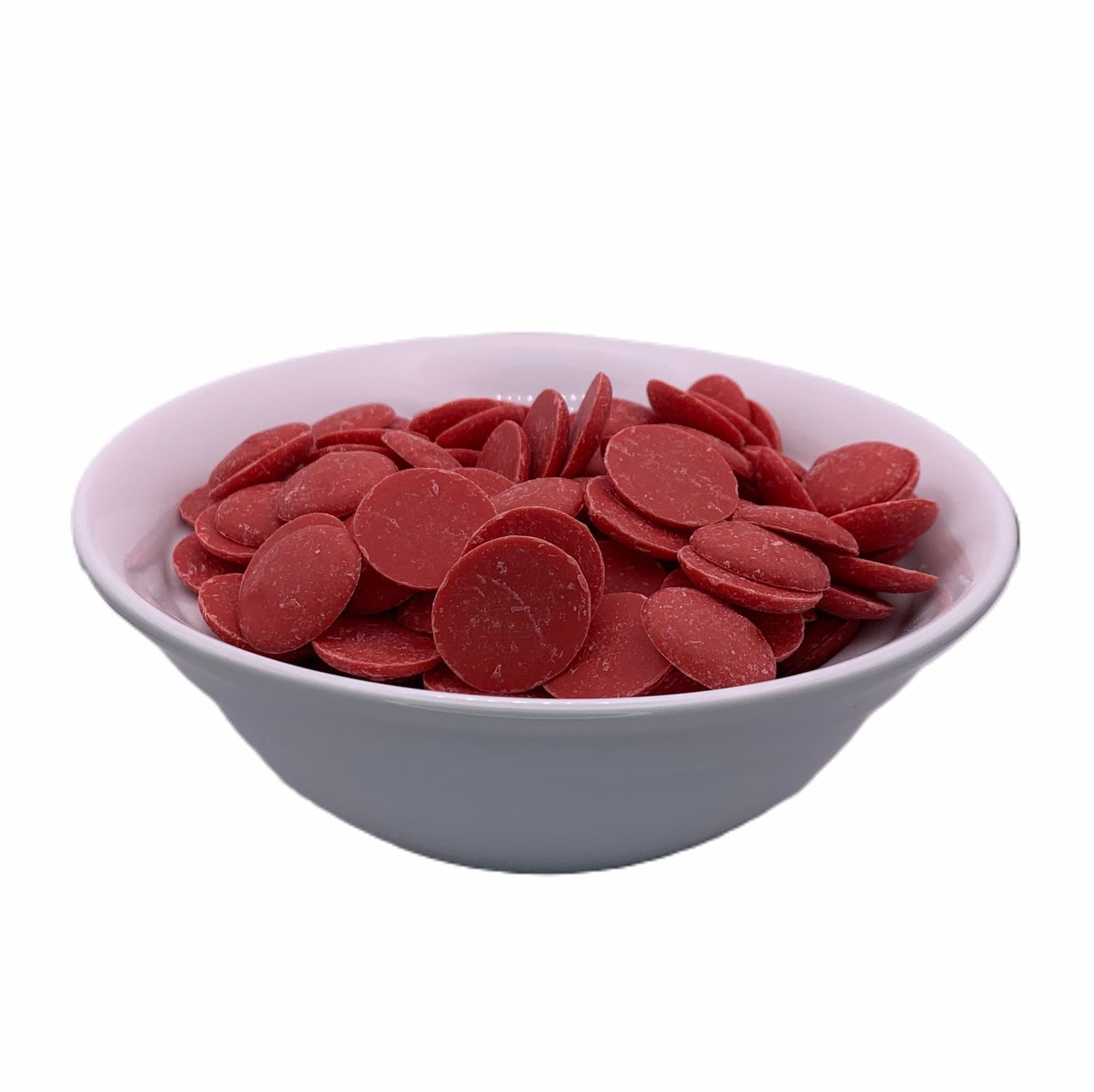 Red chocolate melting wafers by Merckens, captured from a front perspective in a white bowl, ideal for themed treats and holiday confections.