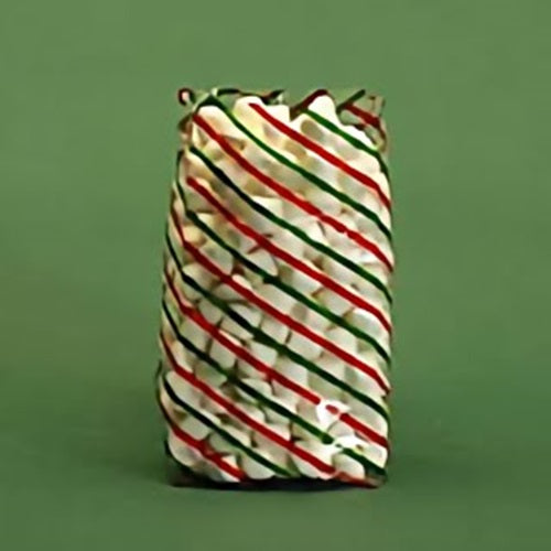 A festive treat bag standing upright with a diagonal stripe pattern in red, green, and gold, creating a traditional Christmas color scheme. The bag appears to be filled, giving it a rounded shape at the top, and is placed against a solid dark green background that complements the holiday theme.