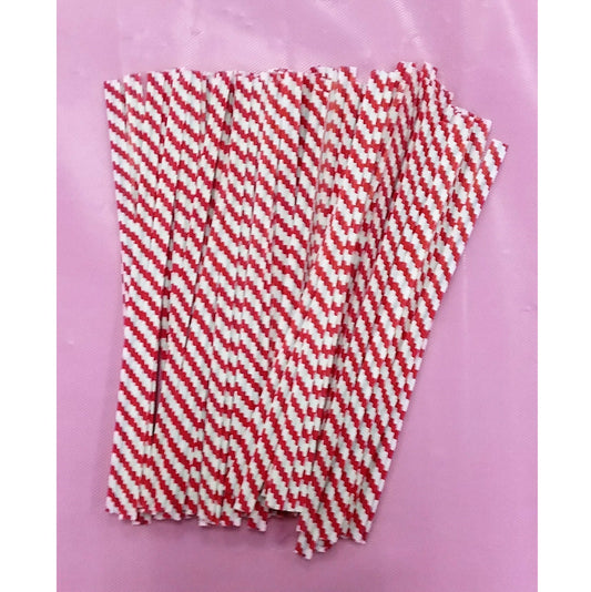 A cluster of red and white paper twist ties with a chevron pattern. They are arranged in an overlapping fashion on a pink surface, which provides a soft contrast to the bright red stripes of the ties. The ties are made of paper and appear to have a slightly frayed texture, indicating they are meant for tying and securing items such as candy bags.