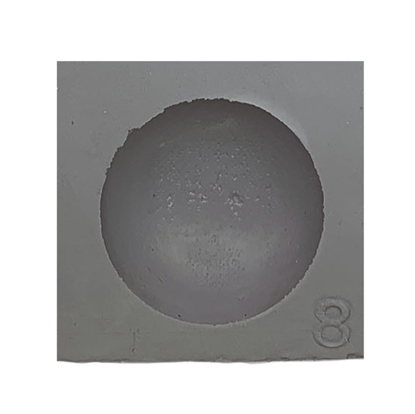 Close-up view of a half-sphere rubber mint mold cavity, designed for round mints, chocolates, or truffles.