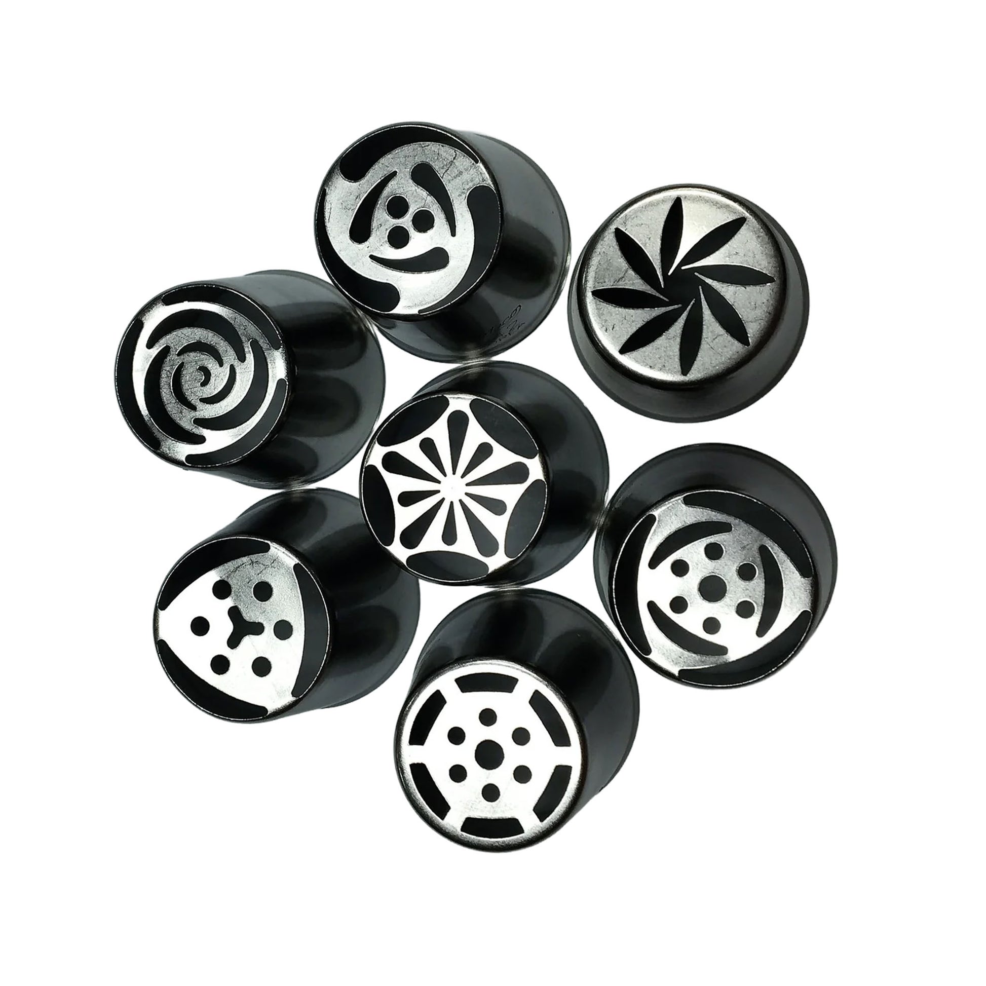 Seven metal Russian piping tips arranged on a white background, each tip showing a different flower-style cutout pattern on the top opening.