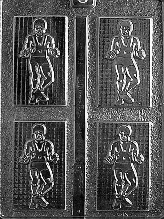 WRESTLER chocolate mold showing a grappler stance figure; compact cavity with defined limbs on a clear sheet.
