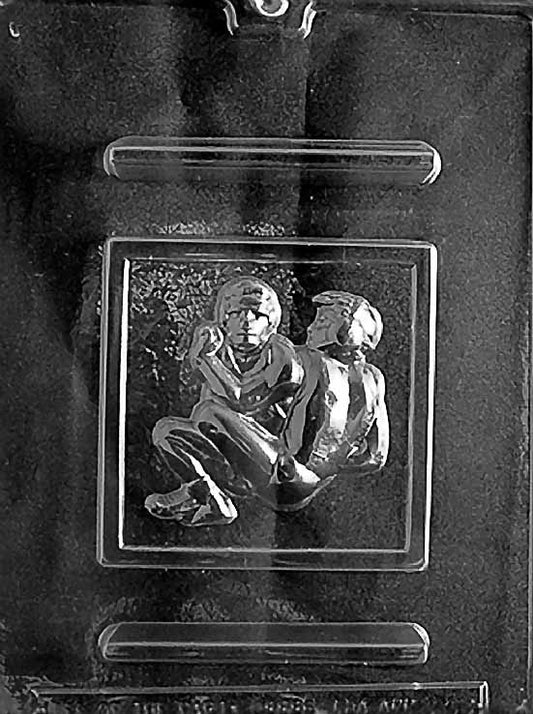 WRESTLING chocolate mold with square cavities embossed with wrestler graphic; clear sheet.