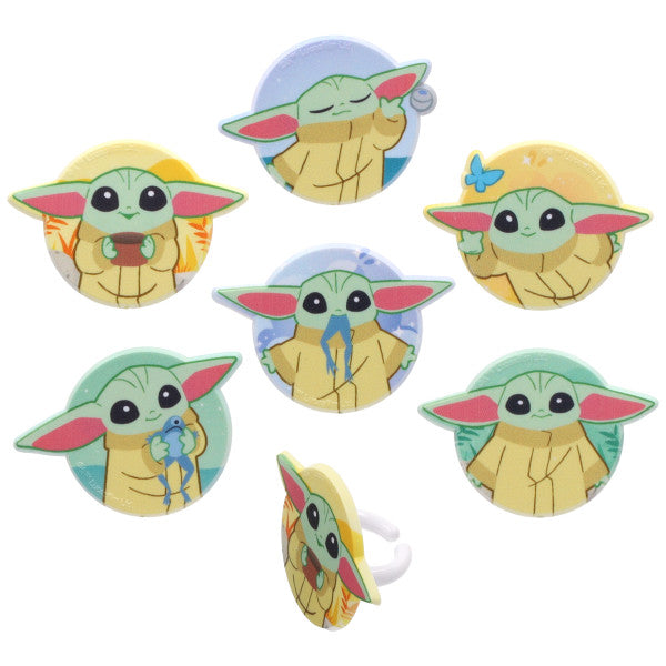 Six Grogu cupcake rings with cartoon Grogu illustrations on round green, blue, and yellow backgrounds, shown on a white background with one ring displayed from the side.