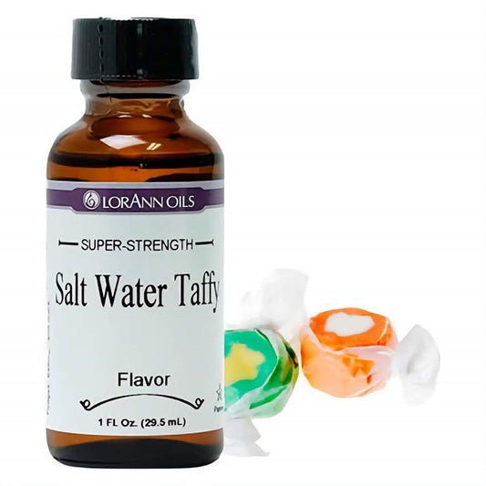 Bottle of LorAnn Oils Super-Strength Salt Water Taffy Flavor, with colorful wrapped taffy candies beside it, ideal for bringing the classic seaside confectionery taste to sweets.