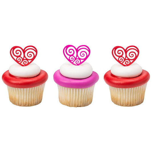 Three Cupcakes with Heart Cupcake Picks in Them. Red and Pink Colored.
