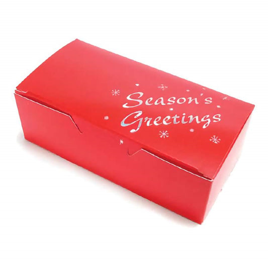The image features a vibrant red 1/2 pound candy box with the phrase "Season's Greetings" in white cursive lettering, accompanied by simple snowflake designs, creating a festive and welcoming look for holiday gift-giving.
