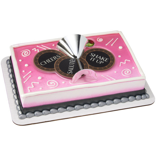 A rectangular cake decorated with the Martini Time DecoSet®, featuring a pink and white design with the martini glass and coasters as the centerpiece.