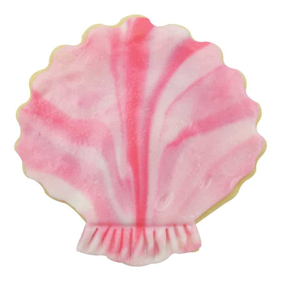 Decorated pink marbled sugar cookie in the shape of a sea shell.