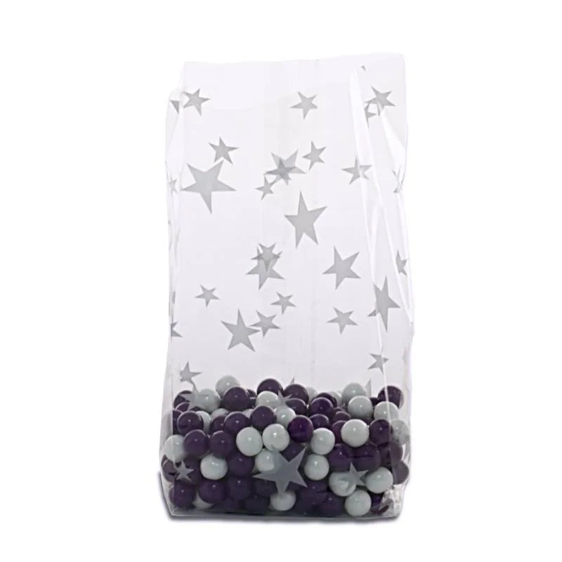 Clear gusseted cello bag with silver star pattern, filled with gray and purple candy balls, ideal for elegant party favors, weddings, or retail treat packaging.