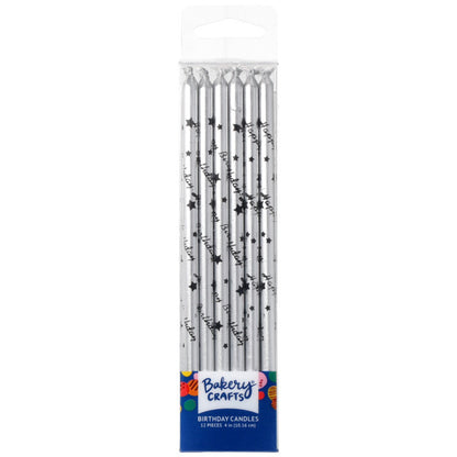 Bakery Crafts silver birthday candles in a clear plastic box, each candle printed with black “Happy Birthday” script and small black stars, 12-count package.
