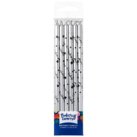 Bakery Crafts silver birthday candles in a clear plastic box, each candle printed with black “Happy Birthday” script and small black stars, 12-count package.