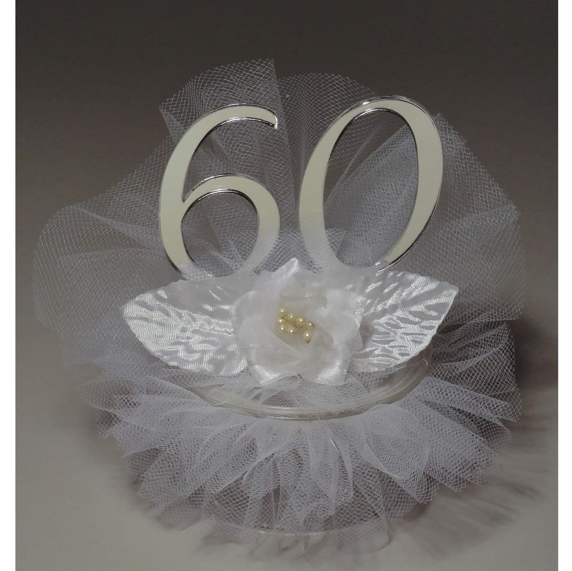Silver 60th-anniversary cake topper, featuring stately '60' numerals on a graceful tulle embellished base, an exquisite decoration for commemorating a diamond anniversary milestone.