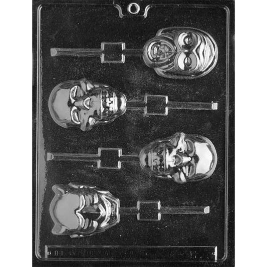 Clear chocolate lollipop mold with four assorted scary face cavities, including two skull designs, a horned devil-like face, and a monster face with raised features.