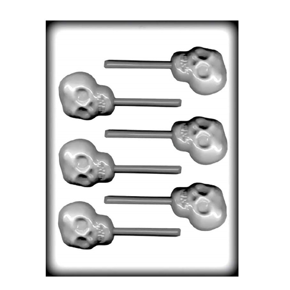 A plastic candy mold featuring six cavities, each shaped like a skull with crossbones. The mold is designed for creating lollipop-style candies, with a stick channel beneath each skull shape. The skulls have detailed features, including eye sockets, nose cavity, and teeth, offering a spooky yet fun design for treats.