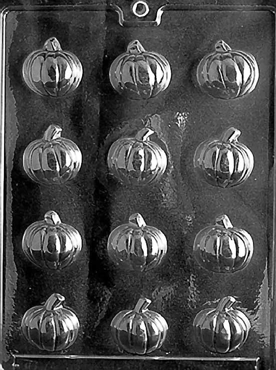 Clear multi-cavity chocolate mold featuring twelve small pumpkins with curved ridges and short stems, arranged in rows on a glossy plastic sheet.