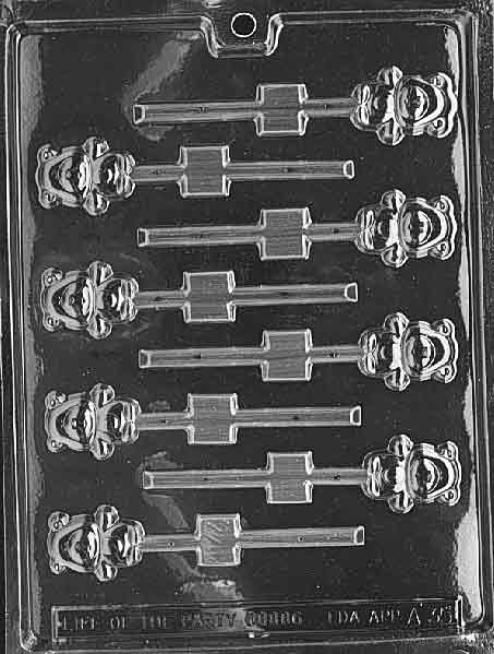 Plastic candy mold with 8 small lollipop cavities shaped like teddy bear faces with ears and facial details, designed for making mini chocolate or candy pops.