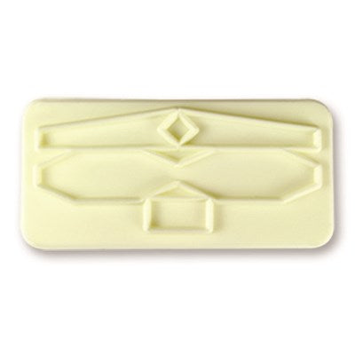 Close-up of one bow cutter showing detailed cutout pattern