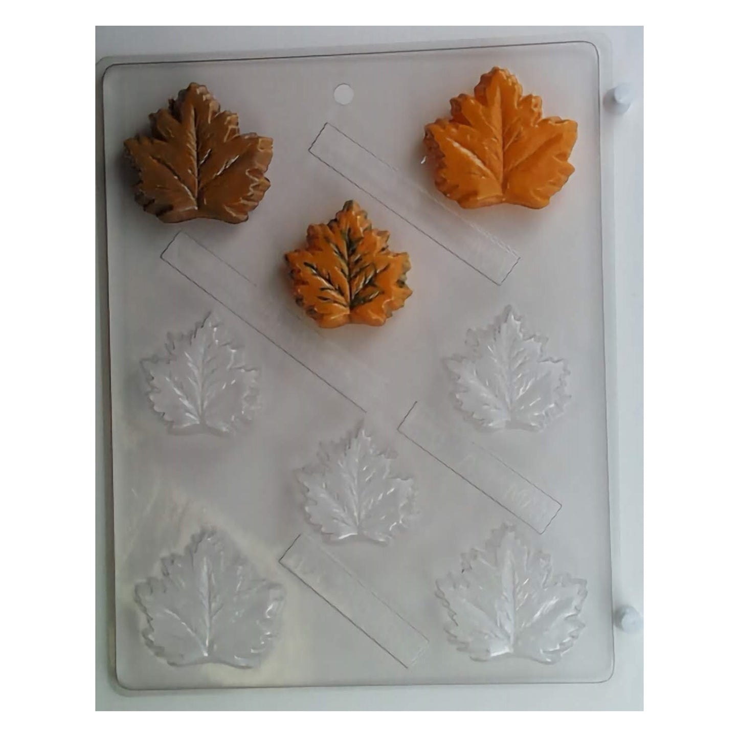 A collection of chocolate molds shaped as small, intricately veined maple and oak leaves, capturing the essence of autumn, ideal for fall-themed events or nature-inspired edible crafts.
