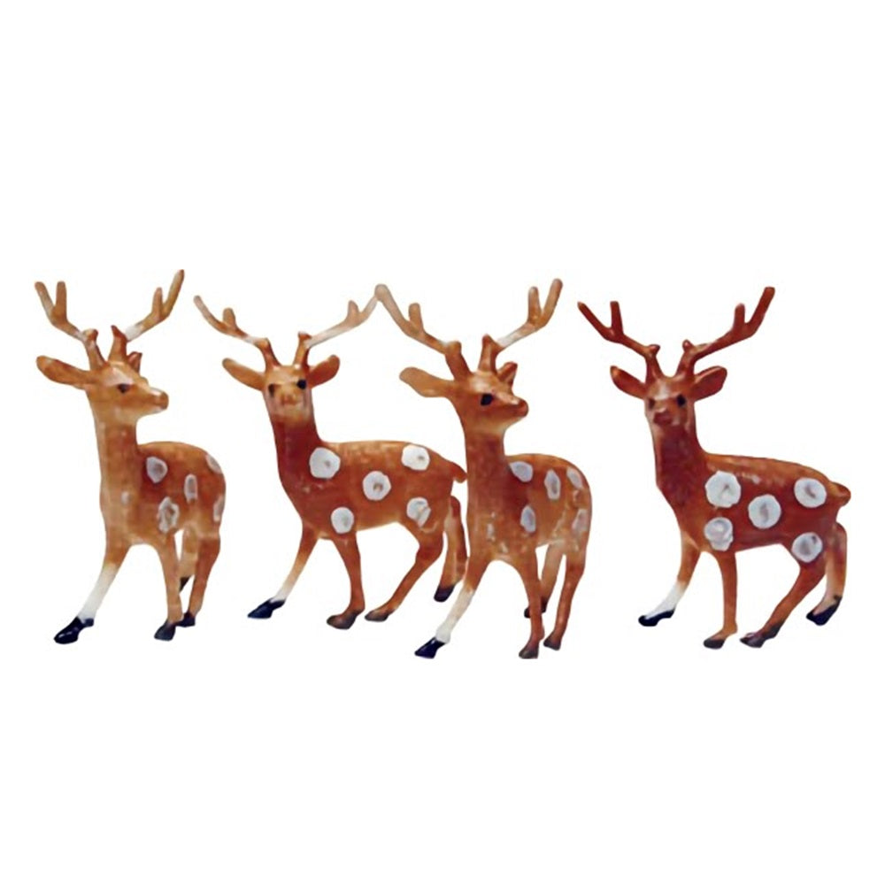 A set of three small reindeer cake toppers, each stag posed differently and adorned with white spots, ideal for creating a charming winter scene on cakes and desserts.
