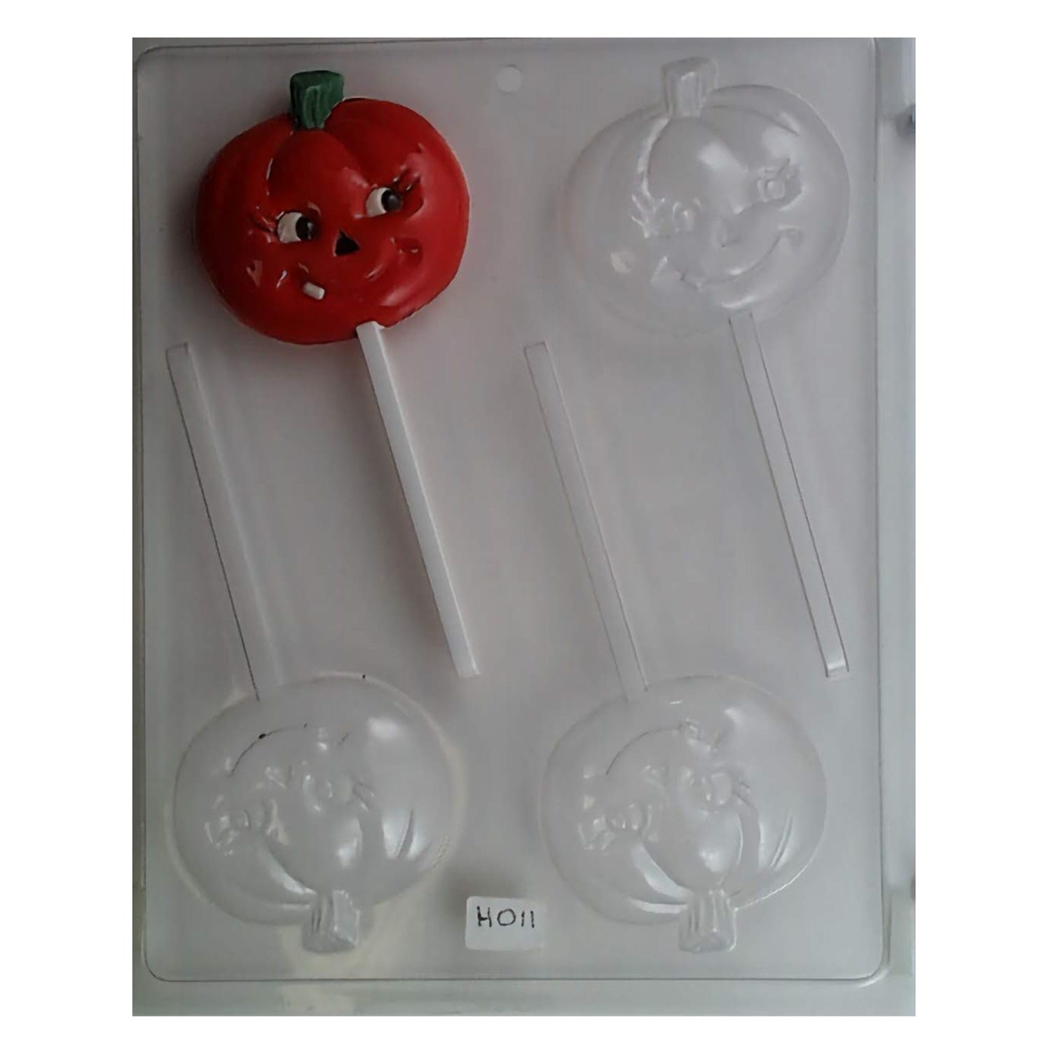 Seasonal lollipop chocolate mold featuring a smiling pumpkin face, perfect for creating Halloween candy suckers.