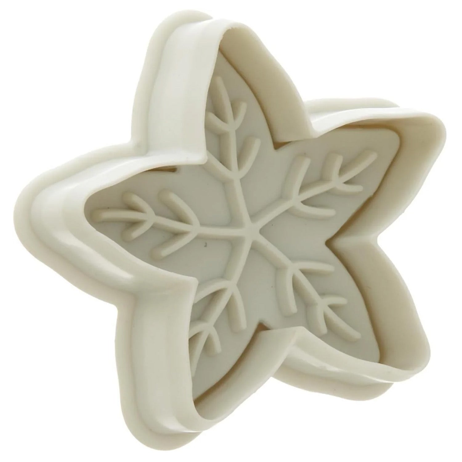 White snowflake-shaped cutter showing the inside embossing plate with raised snowflake branches, on a white background.