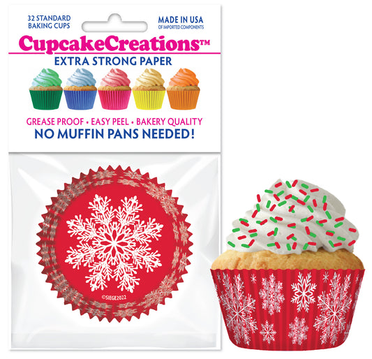Pack of 32 red snowflake cupcake baking cups with festive holiday design, shown with decorated cupcake topped with white frosting and red-green sprinkles.
