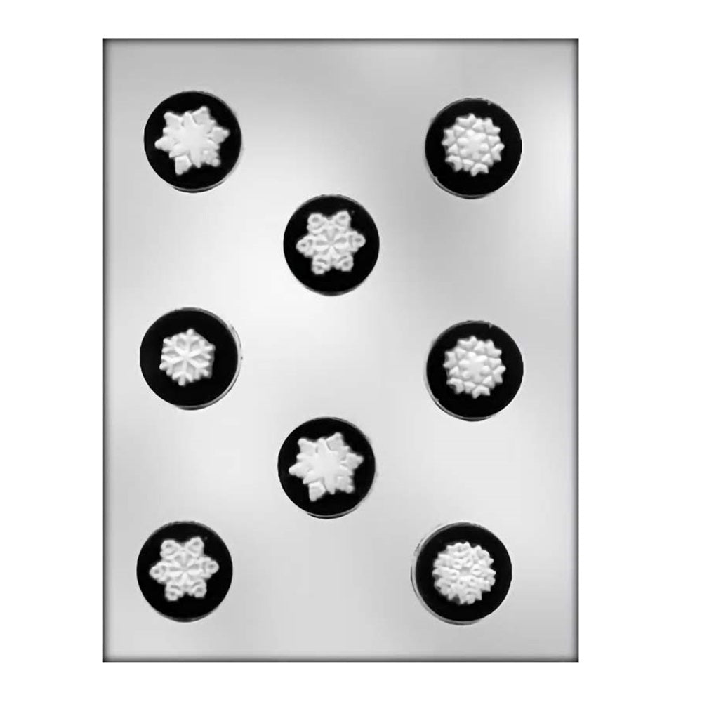 A chocolate mold featuring eight round cavities, each intricately designed with a unique snowflake pattern, ideal for creating festive chocolate snowflakes.