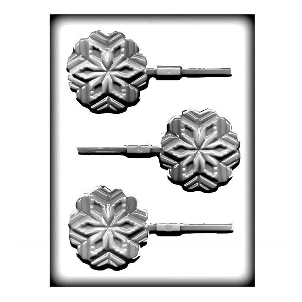 A white hard candy mold that makes snowflake suckers. There are three snowflake shaped cavities on each mold that can accommodate a sucker stick