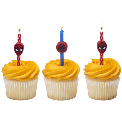 Three cupcakes topped with Spider-Man birthday candles featuring red and blue swirls and Spidey-themed toppers.