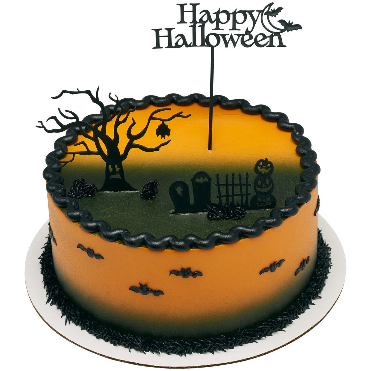 Round orange and black Halloween cake decorated with the Spooky Tree & Graveyard Cake Kit, including a haunted tree, cemetery scene, and Happy Halloween moon topper.