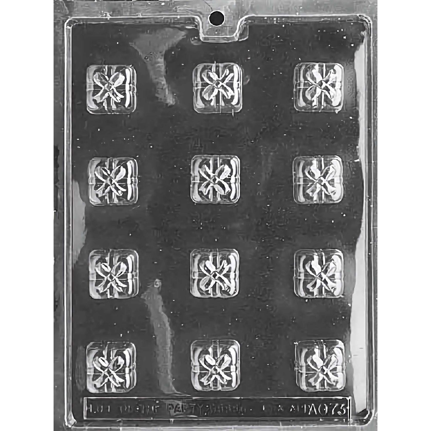 Squares with Bows (Presents) Chocolate Mold with twelve square cavities, each featuring a detailed bow design. The mold creates 1-1/8 inch by 1-1/8 inch and 3/4 inch deep chocolate pieces, using approximately 0.4 ounces of chocolate per piece. Made of food-grade plastic and manufactured in the USA.