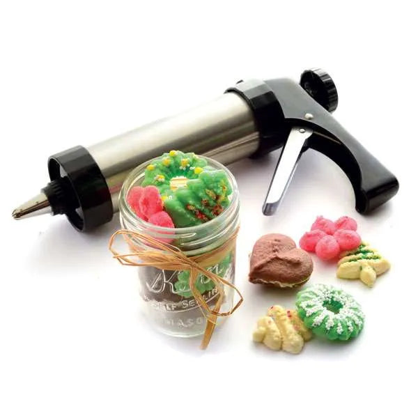 Cookie press with decorated cookies in a gift jar.