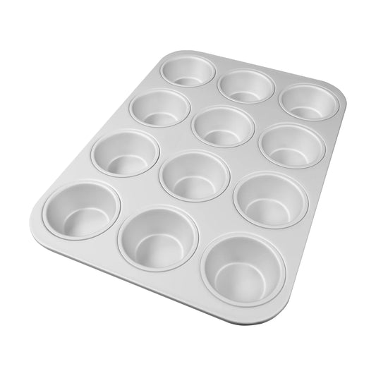 Silver 12-cavity standard muffin pan with rounded corners and a smooth rim, shown at an angle on a white background.