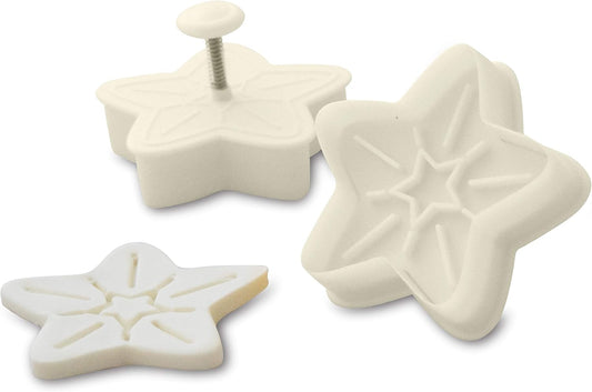 White star-shaped plunger cutters with embossed detailing and a spring-loaded handle.